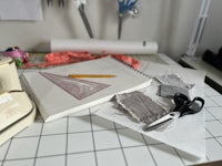 a sewing machine and scissors on a table